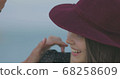 Beautiful girl in a red hat smiles, shows tongue and fooling around 68258609