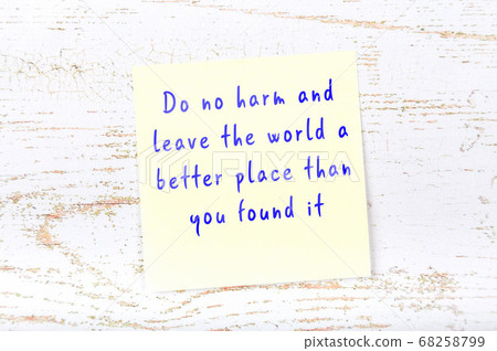 Wise quote on sticky note on wooden wall  68258799