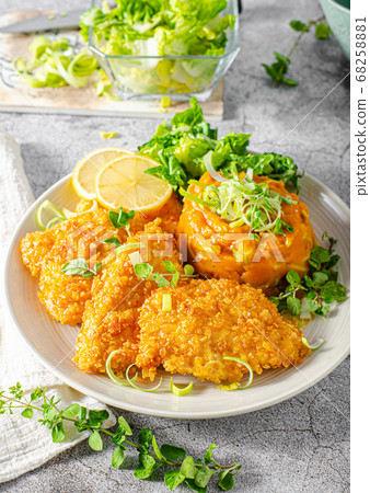 Crispy schnitzel with cornflakes Crispy schnitzel with cornflakes 68258881