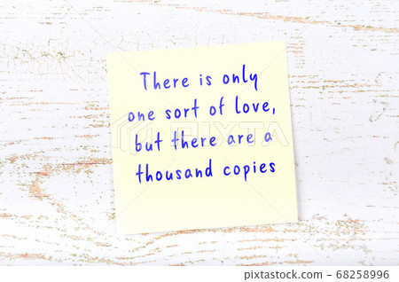Yellow sticky note on wooden wall with wise quote Yellow sticky note on wooden wall with wise quote 68258996