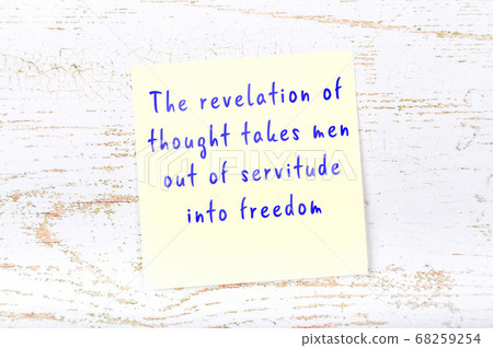 Yellow sticky note on wooden wall with wise quote Yellow sticky note on wooden wall with wise quote 68259254