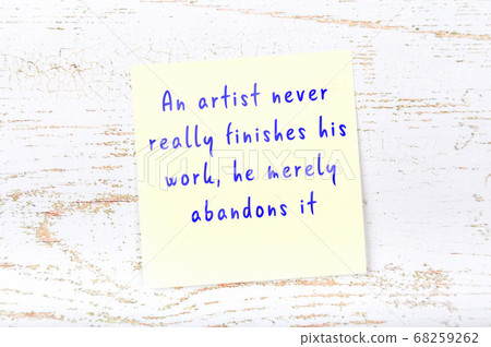 Wise quote on sticky note on wooden wall Wise quote on sticky note on wooden wall 68259262
