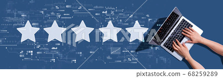 Rating star concept with woman using a laptop Rating star concept with woman using a laptop 68259289