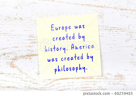 Wise quote on sticky note on wooden wall Wise quote on sticky note on wooden wall 68259483