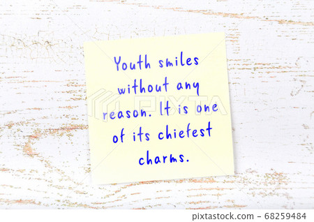 Yellow sticky note on wooden wall with wise quote Yellow sticky note on wooden wall with wise quote 68259484