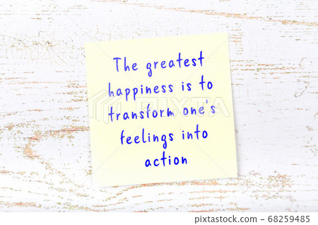 Wise quote on sticky note on wooden wall  68259485