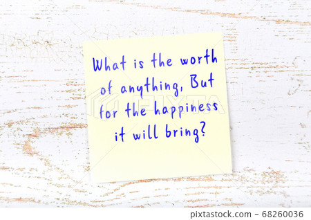 Wise quote on sticky note on wooden wall  68260036