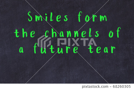 Chalk inscription of smart quote on black desk Chalk inscription of smart quote on black desk 68260305