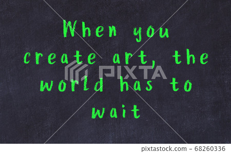 Chalk inscription of smart quote on black desk Chalk inscription of smart quote on black desk 68260336