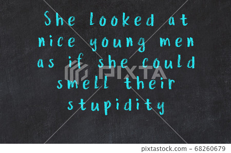 Black chalkboard with wise inscription on it Black chalkboard with wise inscription on it 68260679