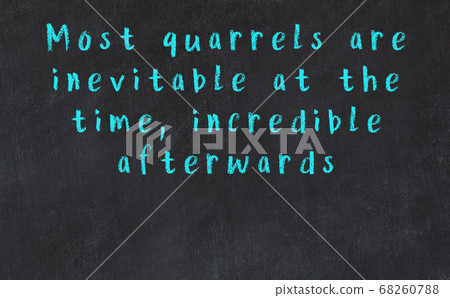 Chalk inscription of smart quote on black desk 68260788