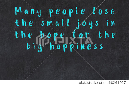 Chalk inscription of smart quote on black desk Chalk inscription of smart quote on black desk 68261027