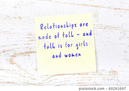 Yellow sticky note on wooden wall with wise quote 68261697