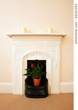 Traditional English Fireplace. A traditional ornate iron fireplace from an 19th century English home. Traditional English Fireplace. A traditional ornate iron fireplace from an 19th century English home. 68262063