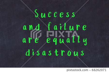 Black chalkboard with wise inscription on it Black chalkboard with wise inscription on it 68262071