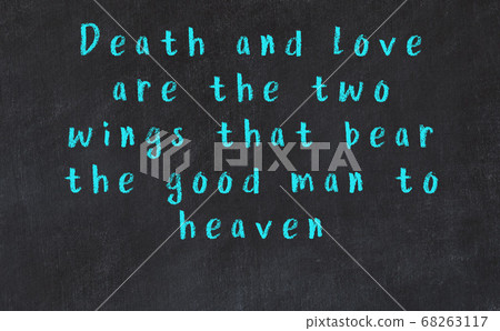 Chalk inscription of smart quote on black desk 68263117