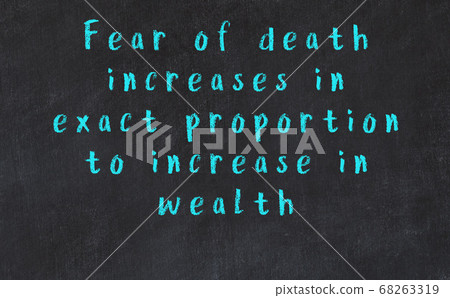 Black chalkboard with wise inscription on it 68263319