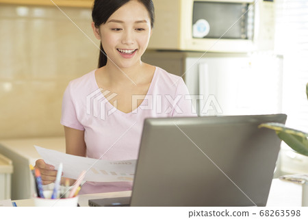 Business woman working at home Business woman working at home 68263598