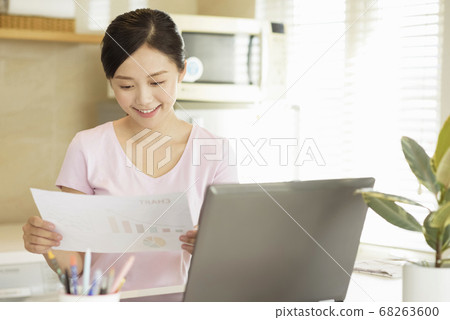 Business woman working at home Business woman working at home 68263600