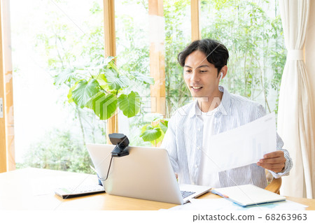 Teleworking young man Teleworking young man 68263963
