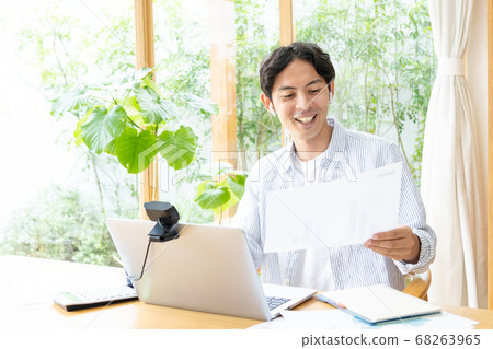 A young man doing telework A young man doing telework 68263965