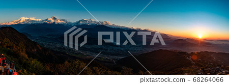 Panoramic view of Pokhara sunrise at Sarangkot Hill with view of Himalayan mountain range. Panoramic view of Pokhara sunrise at Sarangkot Hill with view of Himalayan mountain range. 68264066
