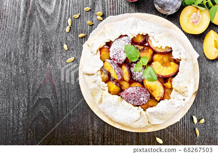 Galeta with plums on board top 68267503