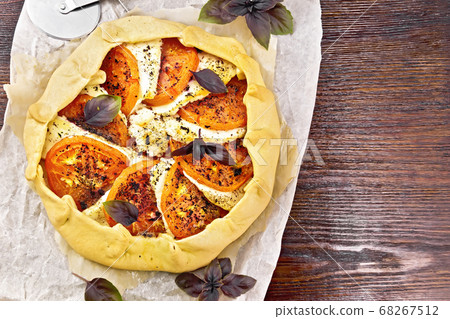 Galeta with tomato and cheese on dark board top 68267512