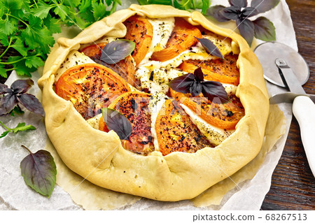 Galeta with tomato and cheese on dark board 68267513