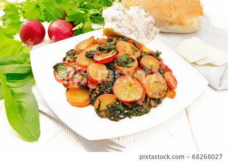 Radish with spinach and spices in plate 68268027