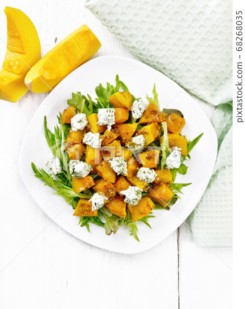 Salad of pumpkin and cheese in plate on top 68268035