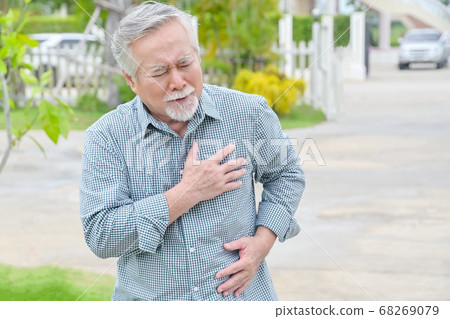 Senior asian man having painful chest heart attack at outdoors home park - heart disease concept Senior asian man having painful chest heart attack at outdoors home park - heart disease concept 68269079