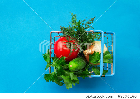 Shopping grocery cart metal on blue background. Shopping grocery cart metal on blue background. 68270166
