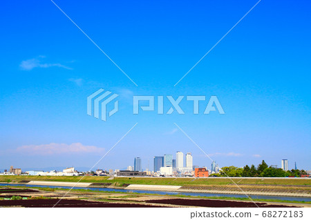 Scenery of the skyscrapers in front of Nagoya station seen from the Shonaigawa riverbed 68272183