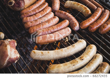 Sausages on BBQ Grill fire Outdoor party Camping lifestyle Sausages on BBQ Grill fire Outdoor party Camping lifestyle 68272435