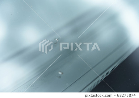 A scratch on the windshield of a car A scratch on the windshield of a car 68273874