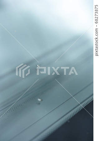 A scratch on the windshield of a car A scratch on the windshield of a car 68273875