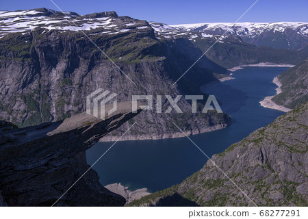 Fjord with a rock like a tongue Fjord with a rock like a tongue 68277291