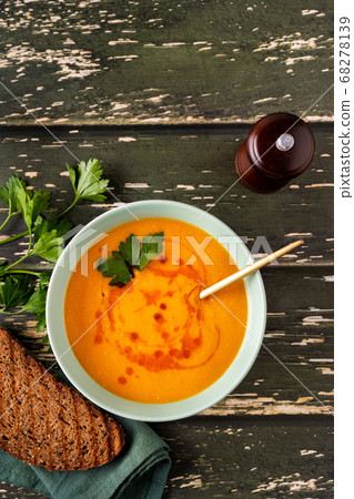Top view of a plate with delicious creamy winter lentil soup Top view of a plate with delicious creamy winter lentil soup 68278139
