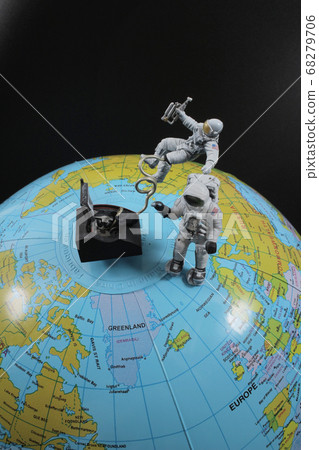 figure of Astronaut in outer space over of Earth 68279706