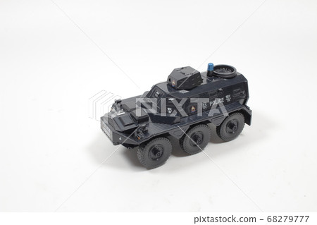 Scale police car model with figure at the white Scale police car model with figure at the white 68279777