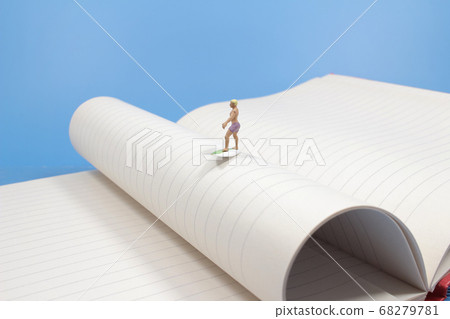 Young surfers figure on the book, the waves before Young surfers figure on the book, the waves before 68279781