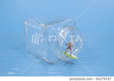 A Young surfers figure on the bottle, the waves A Young surfers figure on the bottle, the waves 68279787