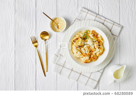Cauliflower cheese with garlic and thyme, flat lay 68280089