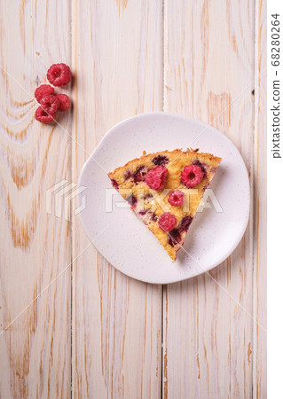 Sweet tasty pie slice with jellied and fresh raspberry fruits in plate Sweet tasty pie slice with jellied and fresh raspberry fruits in plate 68280264