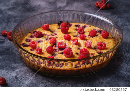 Sweet tasty pie with jellied and fresh raspberry fruits in baking dish 68280267