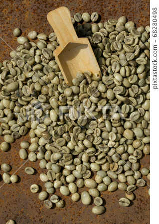 green coffee beans with wooden spoon green coffee beans with wooden spoon 68280498