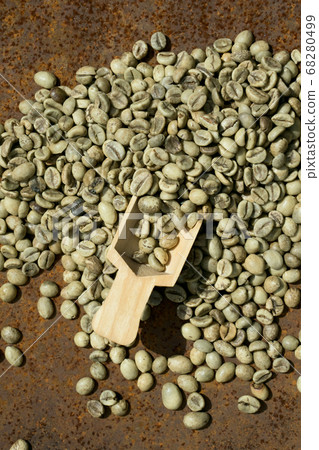 green coffee beans with wooden spoon green coffee beans with wooden spoon 68280499