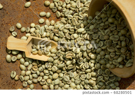 green coffee beans in wooden bowl 68280501