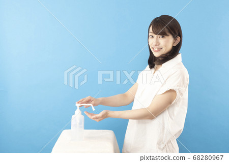 Woman disinfecting alcohol Woman disinfecting alcohol 68280967